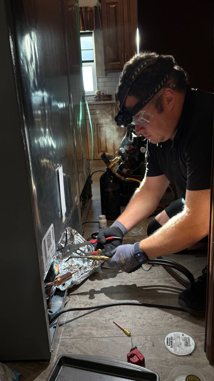 Refrigerator cooling-system service at close range